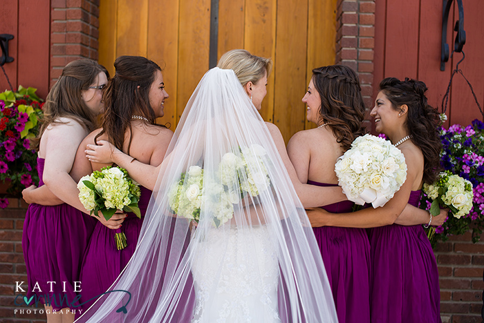 gorgeous wedding bouquets with bridesmaids, cathedral length gown and veil for wedding, purple bridesmaids dresses, farm wedding photographer, Colorado farm wedding photographer, Colorado barn wedding photographer, cowboy wedding boots, name cards wedding, wedding dress bridal collection denver