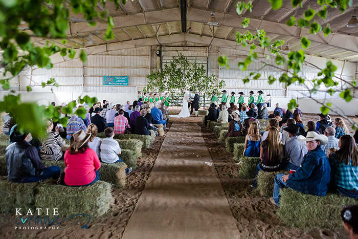 hay bale wedding seating, panels with branches, cowboy western ceremony